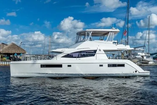 Slide: The Image of 2017 Leopard 51 Powercat yacht on water, clear sky background. - 146