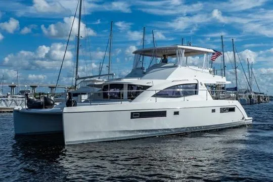 Slide: The Image of 2017 Leopard 51 Powercat yacht docked in marina under blue sky. - 149