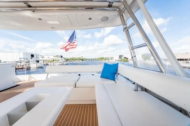 Slide: The Image of Luxurious 2017 Leopard 51 Powercat yacht with spacious deck and American flag. - 22