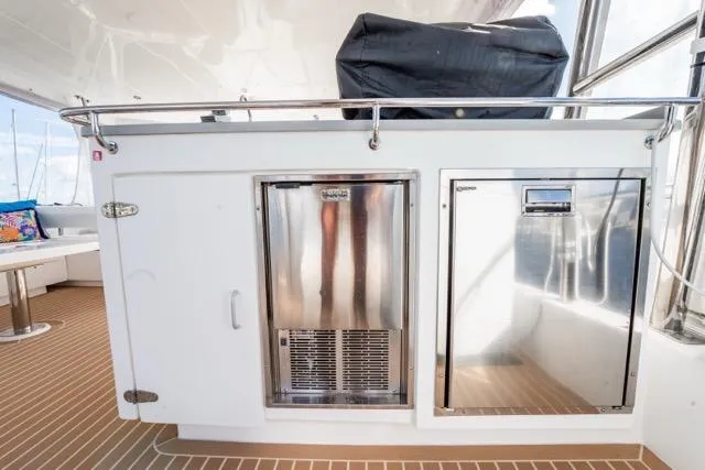 Slide: The Image of Outdoor kitchen area on a 2017 Leopard 51 Powercat yacht with stainless steel appliances. - 24