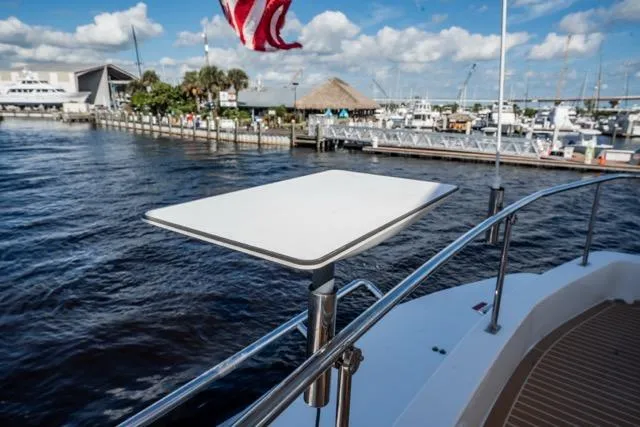 Slide: The Image of 2017 Leopard 51 Powercat with a sleek deck and marina view. - 26