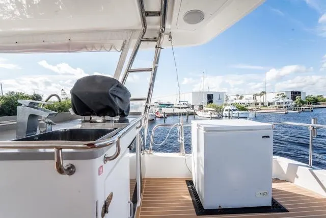 Slide: The Image of 2017 Leopard 51 Powercat deck with outdoor kitchen and marina view. - 27