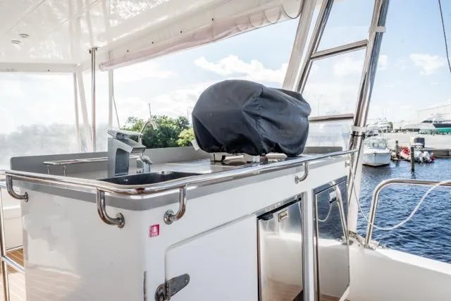 Slide: The Image of Outdoor kitchen on 2017 Leopard 51 Powercat yacht with sink and covered grill. - 29