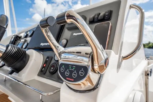 Slide: The Image of Control panel of 2017 Leopard 51 Powercat with Yamaha throttle and Raymarine displays. - 39