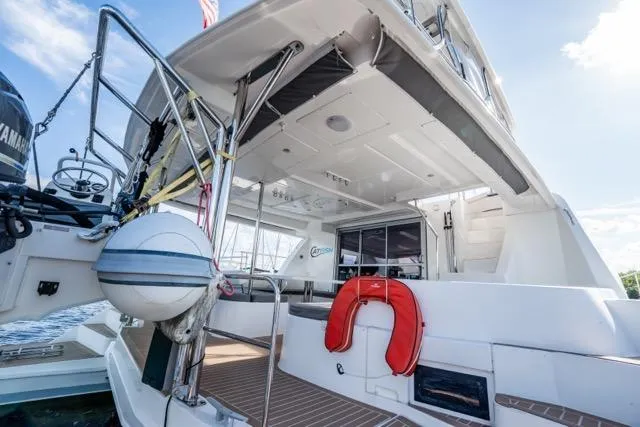 Slide: The Image of 2017 Leopard 51 Powercat yacht stern view with life preserver and deck details. - 56