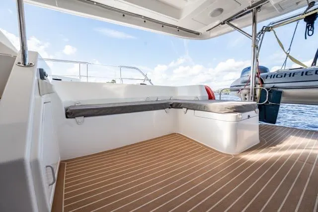 Slide: The Image of 2017 Leopard 51 Powercat deck with cushioned seating and wooden flooring. - 59