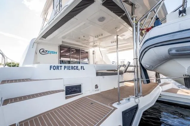 Slide: The Image of 2017 Leopard 51 Powercat docked in Fort Pierce, FL, featuring spacious deck and modern design. - 63