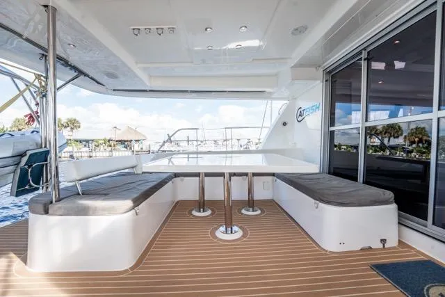 Slide: The Image of 2017 Leopard 51 Powercat yacht with spacious outdoor seating and sleek design. - 68