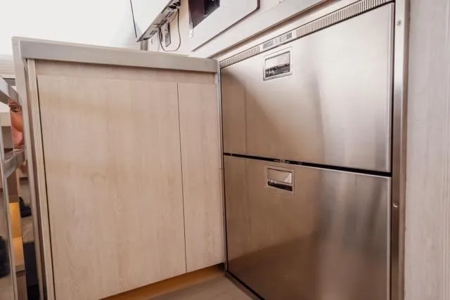 Slide: The Image of Modern kitchen area in 2017 Leopard 51 Powercat with stainless steel appliances. - 75