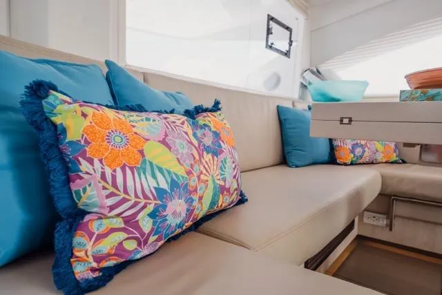 Slide: The Image of Luxurious interior of 2017 Leopard 51 Powercat with vibrant floral cushions. - 79