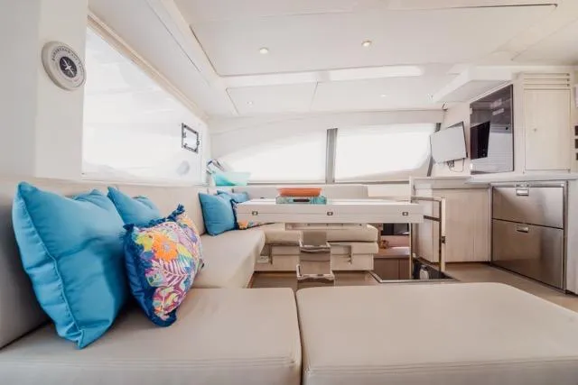 Slide: The Image of Luxurious interior of 2017 Leopard 51 Powercat with modern furnishings and vibrant cushions. - 80