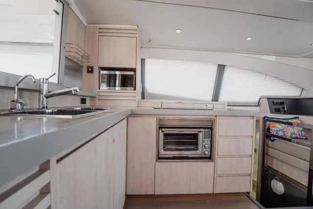 Slide: The Image of Modern kitchen interior of 2017 Leopard 51 Powercat yacht with sleek cabinetry and appliances. - 85