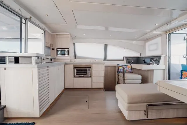Slide: The Image of Luxurious interior of 2017 Leopard 51 Powercat yacht with modern kitchen and seating area. - 86