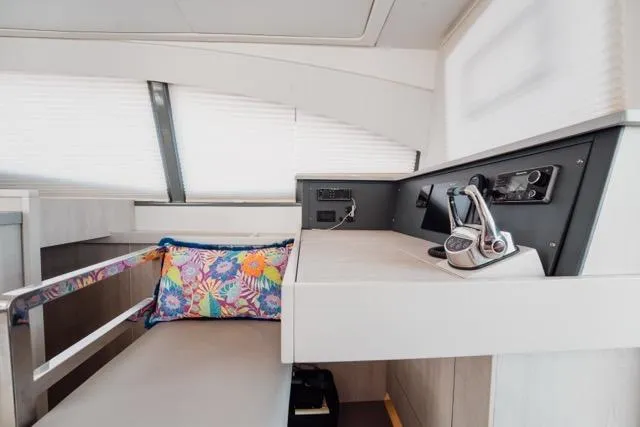 Slide: The Image of 2017 Leopard 51 Powercat interior helm with colorful cushion and modern controls. - 91