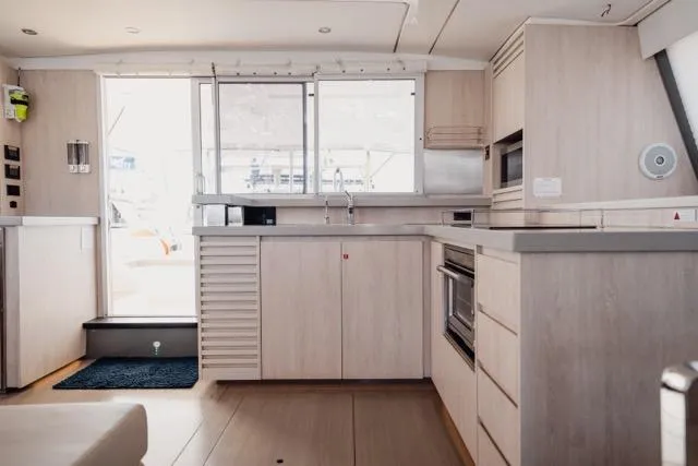 Slide: The Image of Modern kitchen interior of 2017 Leopard 51 Powercat yacht, featuring sleek cabinetry and appliances. - 95