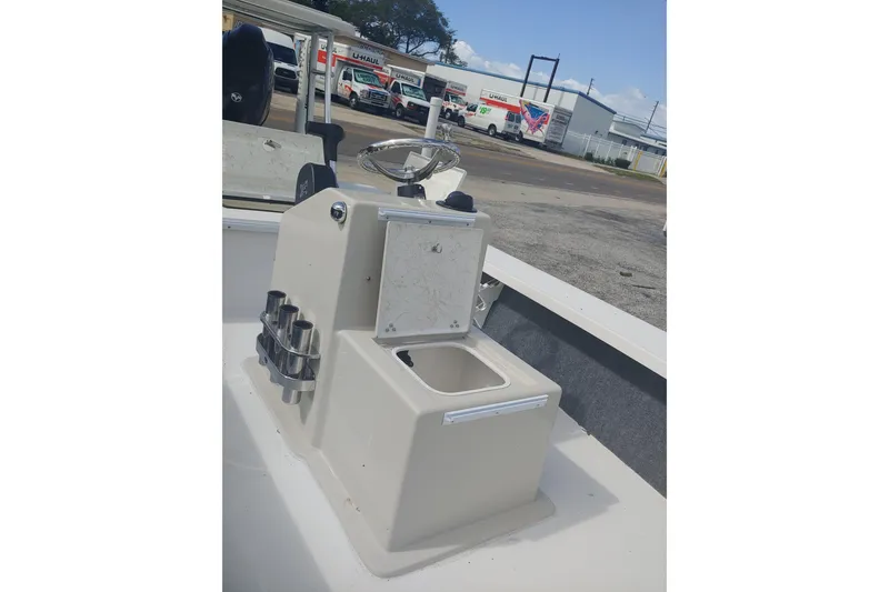 Slide: The Image of 2026 Mitzi Skiffs 17 Tournament boat console with steering wheel and storage compartment. - 6