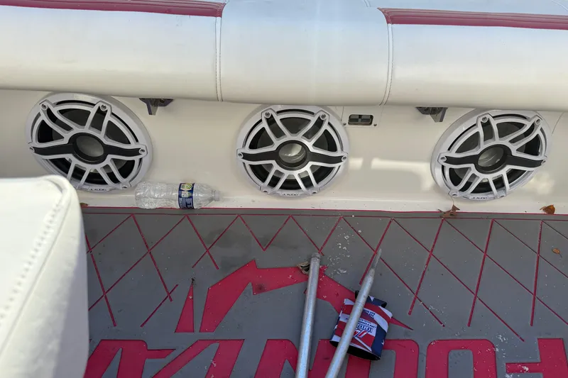 Slide: The Image of 2004 Fountain 42 Lightning boat interior with speakers and accessories on the floor. - 16