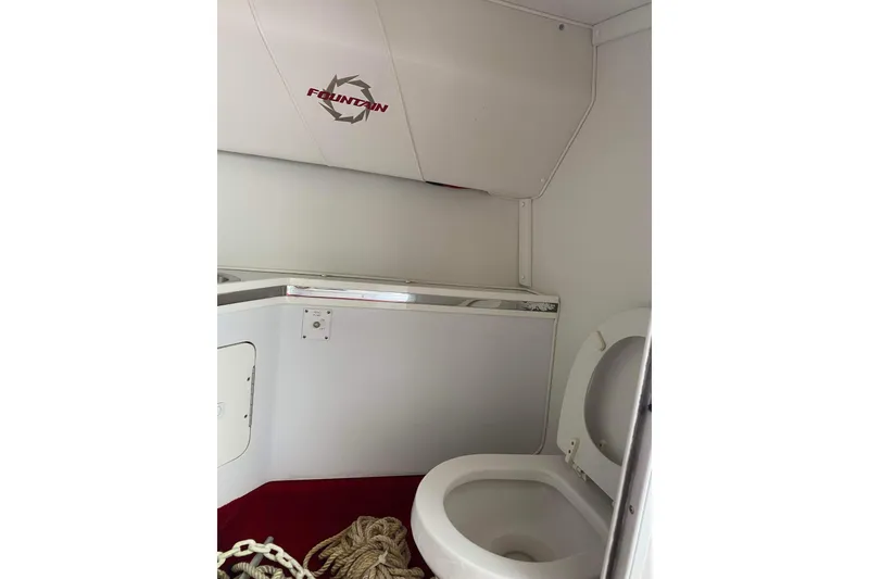 Slide: The Image of Interior of 2004 Fountain 42 Lightning boat bathroom with toilet and storage. - 20