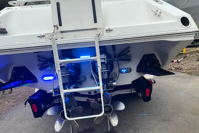 Slide: The Image of Rear view of 2004 Fountain 42 Lightning boat with blue LED lights and dual propellers. - 3