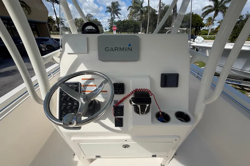 Slide: The Image of 2021 Cobia 237 Center Console boat dashboard with Garmin navigation system. - 11
