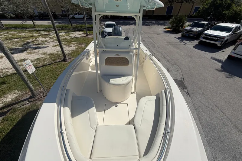 Slide: The Image of 2021 Cobia 237 Center Console boat with spacious seating and sleek design. - 7