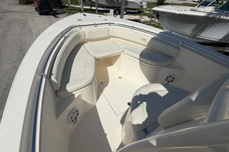 Slide: The Image of 2021 Cobia 237 Center Console boat with spacious seating and sleek design. - 8