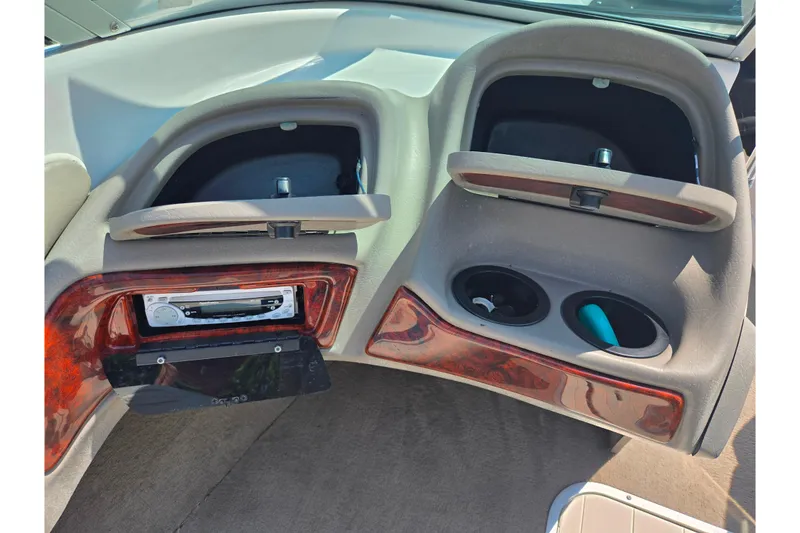 Slide: The Image of 2003 Tahoe Q5L dashboard with open compartments and stereo system. - 14