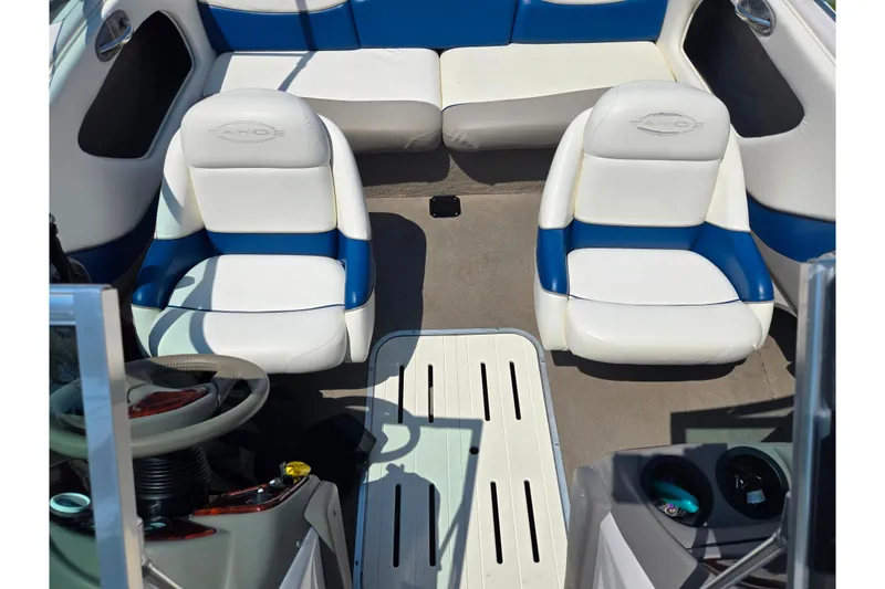 Slide: The Image of Interior of a 2003 Tahoe Q5L boat with blue and white seating. - 20