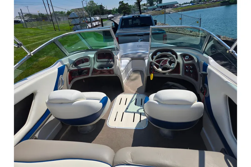 Slide: The Image of Interior of a 2003 Tahoe Q5L boat with seating and steering wheel. - 25