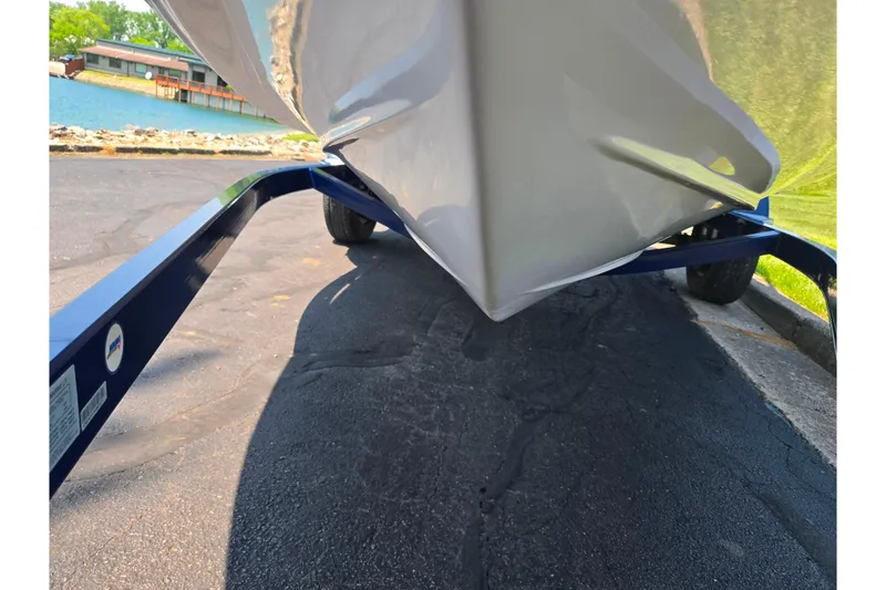 Slide: The Image of Boat on trailer near lake, Tahoe Q5L, 2003 model, sunny day. - 7