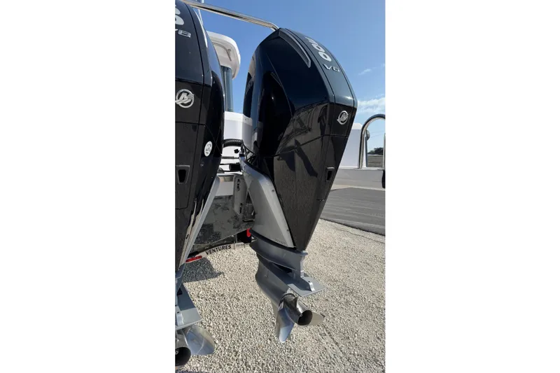 Slide: The Image of 2023 Axopar 37 XC CROSS CABIN with dual outboard engines, rear view. - 13