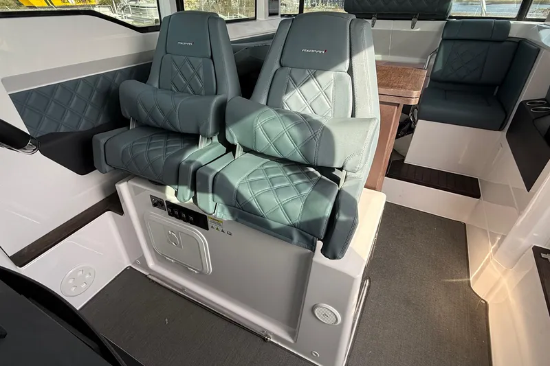 Slide: The Image of Interior of 2023 Axopar 37 XC CROSS CABIN with luxurious seating and modern design. - 21