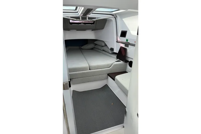 Slide: The Image of Interior cabin of 2023 Axopar 37 XC CROSS CABIN with modern design and comfortable seating. - 30
