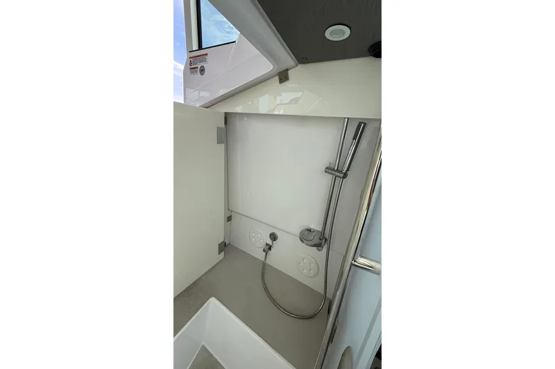Slide: The Image of 2023 Axopar 37 XC CROSS CABIN bathroom with modern shower design. - 32