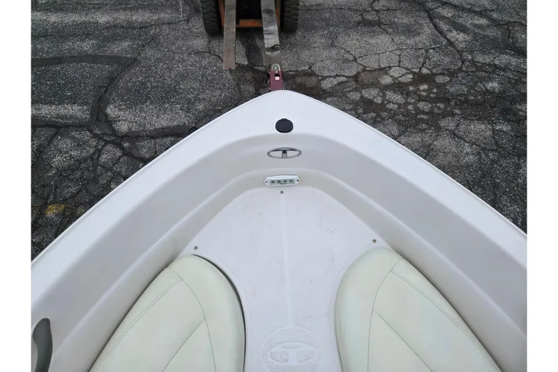 Slide: The Image of Bow view of 2011 Tahoe Q4 SS boat on cracked pavement. - 31