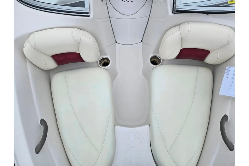 Slide: The Image of 2011 Tahoe Q4 SS boat interior with white and red cushioned seats. - 32