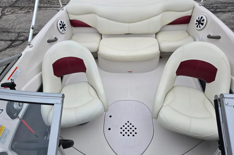 Slide: The Image of Interior of a 2011 Tahoe Q4 SS boat with white and red seating. - 34