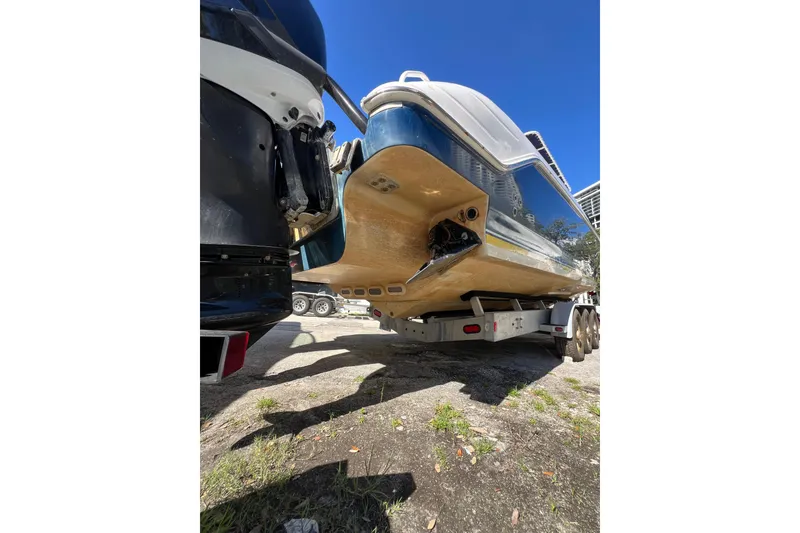 Slide: The Image of 2008 Donzi 38 ZFX Open boat on trailer, viewed from rear under sunny sky. - 16