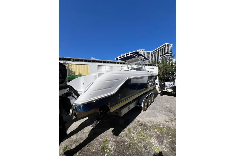 Slide: The Image of 2008 Donzi 38 ZFX Open boat on trailer under clear blue sky. - 17