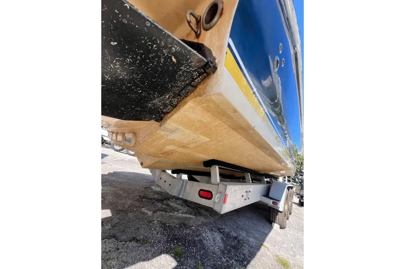 Slide: The Image of 2008 Donzi 38 ZFX Open boat on trailer, showing hull and underside details. - 21
