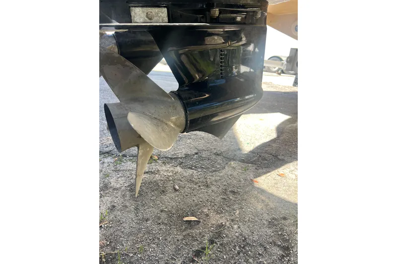 Slide: The Image of Propeller of 2008 Donzi 38 ZFX Open boat on pavement background. - 25