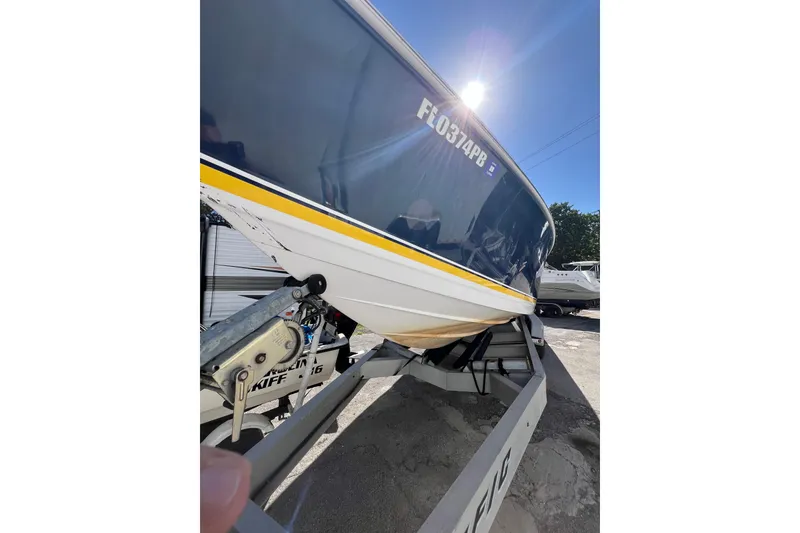 Slide: The Image of 2008 Donzi 38 ZFX Open boat on trailer under bright sunlight. - 27