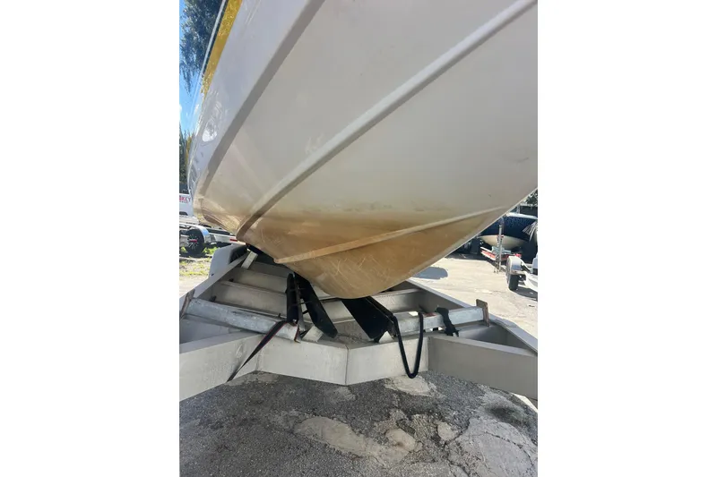 Slide: The Image of 2008 Donzi 38 ZFX Open boat on trailer, showing hull and support straps. - 29