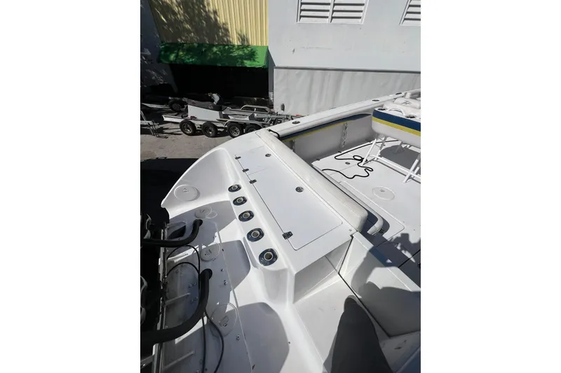 Slide: The Image of 2008 Donzi 38 ZFX Open boat deck with seating and storage compartments. - 32