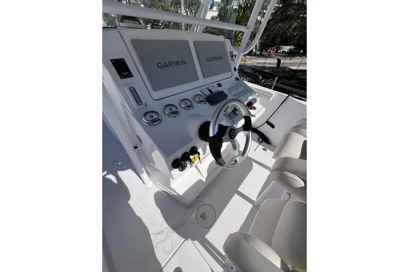 Slide: The Image of 2008 Donzi 38 ZFX Open boat cockpit with Garmin navigation system and steering wheel. - 40