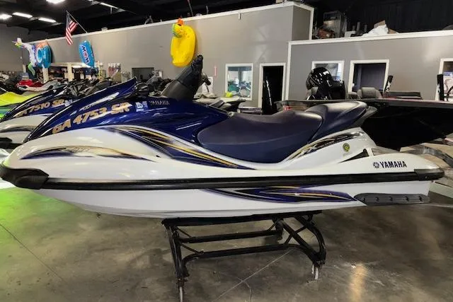 Slide: The Image of 2004 Yamaha WaveRunner FX jet ski displayed indoors on a stand. - 4
