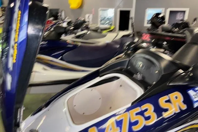 Slide: The Image of 2004 Yamaha WaveRunner FX in showroom, blue and white, side view. - 8