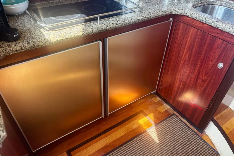 Slide: The Image of Luxurious kitchen area in a 2006 Sea Ray 52 Sedan Bridge yacht. - 30