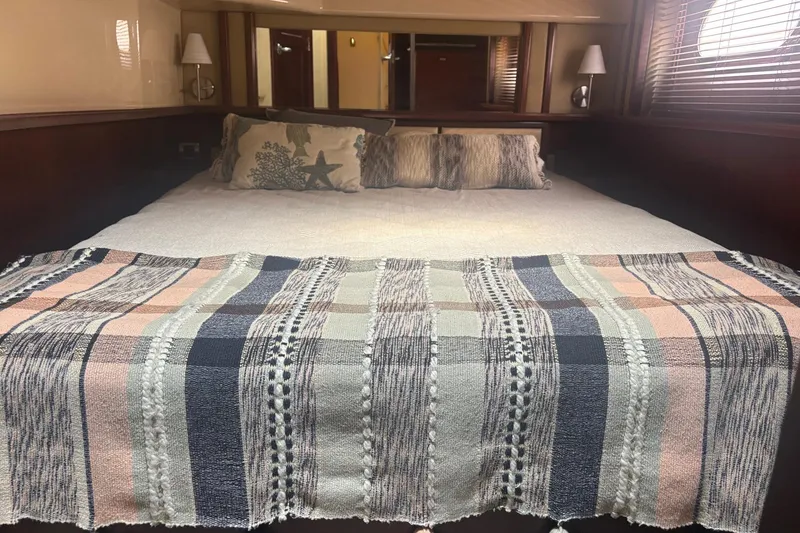 Slide: The Image of Luxurious bedroom interior of 2006 Sea Ray 52 Sedan Bridge yacht. - 33