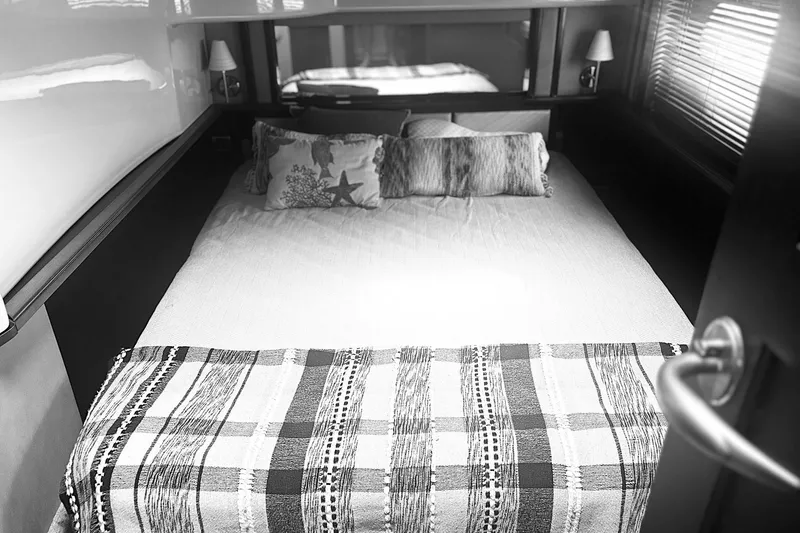 Slide: The Image of Cozy bedroom interior of 2006 Sea Ray 52 Sedan Bridge yacht with decorative pillows. - 34